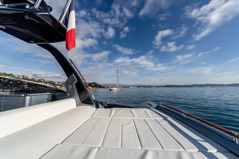 2021 Riva 56 Rivale &ldquo;grey&rdquo; Yacht Photos Pics Luxurious 2021 Riva 56 yacht with sunbed, ocean view, and clear blue sky.