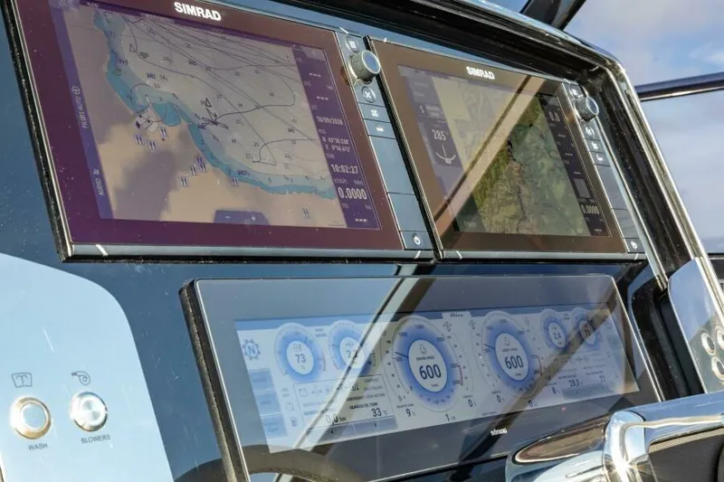 2021 Riva 56 Rivale &ldquo;grey&rdquo; Yacht Photos Pics Control panel of a 2021 Riva 56 yacht with navigation displays.