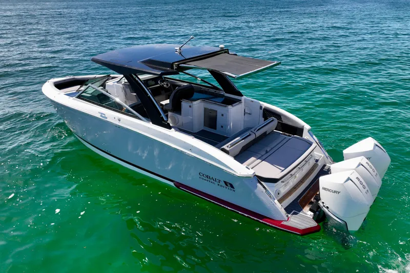  Yacht Photos Pics 2025 Cobalt R33 Outboard boat on clear blue water, featuring sleek design and powerful engines.