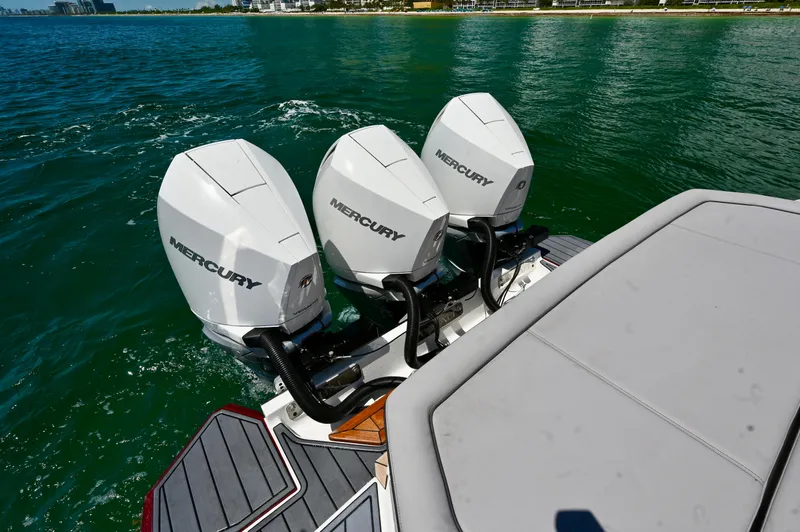  Yacht Photos Pics 2025 Cobalt R33 Outboard with triple Mercury engines on a calm sea.