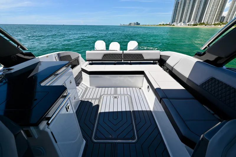  Yacht Photos Pics 2025 Cobalt R33 Outboard boat interior with sleek seating, ocean view, and modern design.