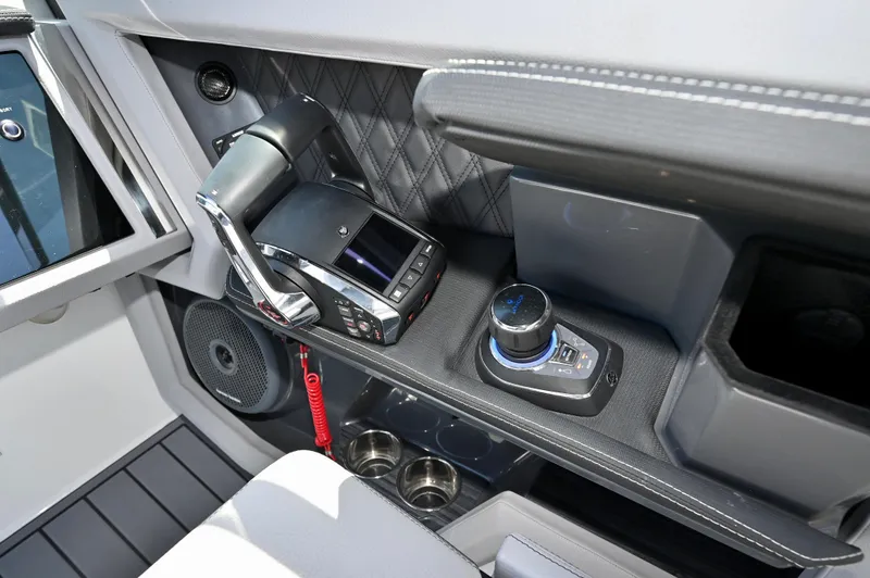  Yacht Photos Pics Control panel of 2025 Cobalt R33 Outboard boat with modern throttle and joystick.