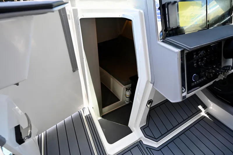  Yacht Photos Pics 2025 Cobalt R33 Outboard interior cabin entrance with modern dashboard and flooring.