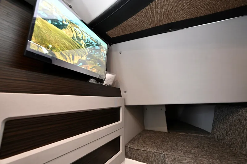  Yacht Photos Pics 2025 Cobalt R33 Outboard cabin interior with TV and modern design.