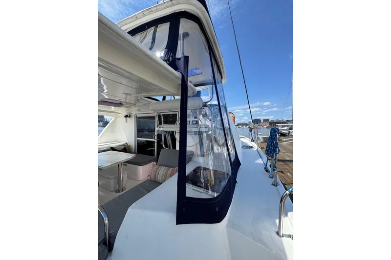  Yacht Photos Pics 2012 Leopard 39 Owner's Version catamaran, featuring spacious deck and seating area, docked at marina.