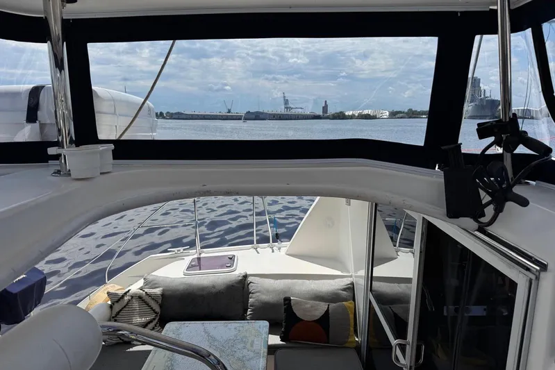  Yacht Photos Pics Interior view of 2012 Leopard 39 Owner's Version catamaran with waterfront backdrop.