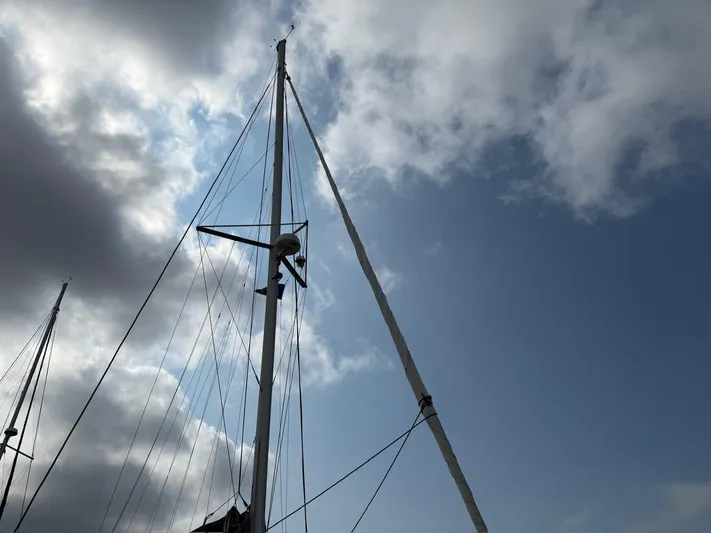  Yacht Photos Pics Sailboat mast against cloudy sky, Leopard 39 Owner's Version, 2012 model.