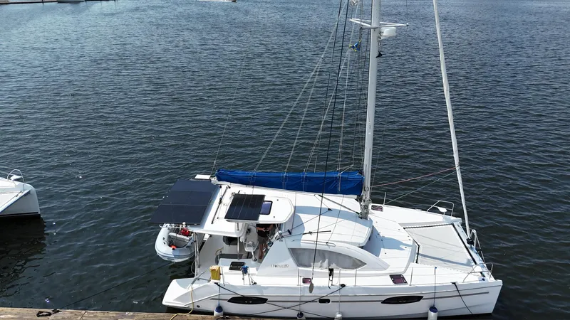 Yacht Photos Pics 2012 Leopard 39 Owner's Version catamaran docked on calm water.