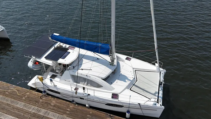  Yacht Photos Pics 2012 Leopard 39 Owner's Version catamaran docked, featuring solar panels and a sleek design.