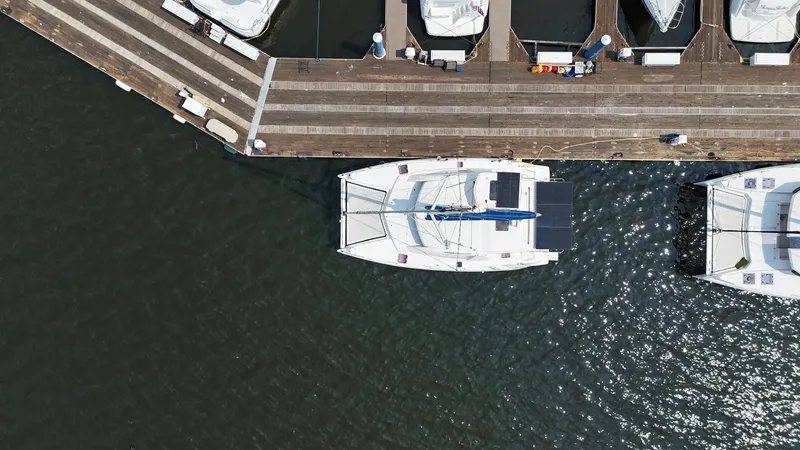  Yacht Photos Pics Aerial view of a 2012 Leopard 39 Owner's Version catamaran docked at a marina.