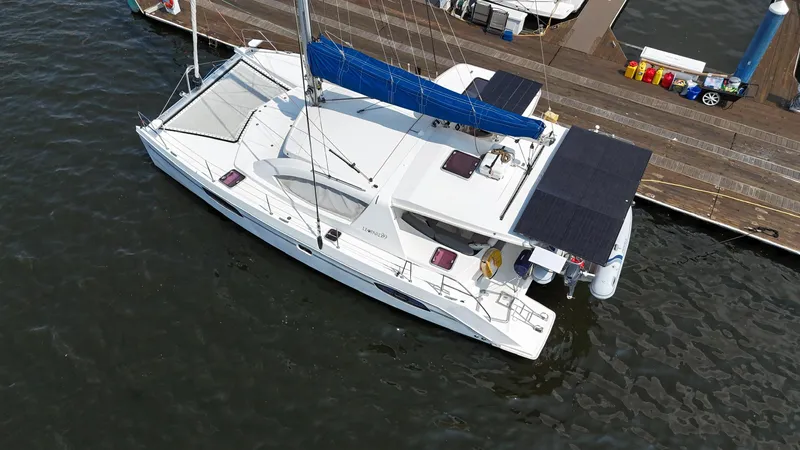  Yacht Photos Pics Aerial view of a 2012 Leopard 39 Owner's Version catamaran docked at a marina.