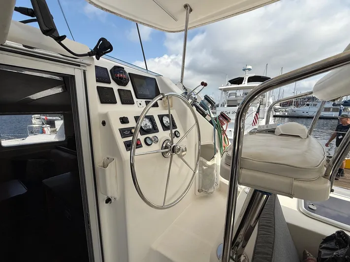  Yacht Photos Pics Helm of 2012 Leopard 39 Owner's Version catamaran with steering wheel and navigation instruments.