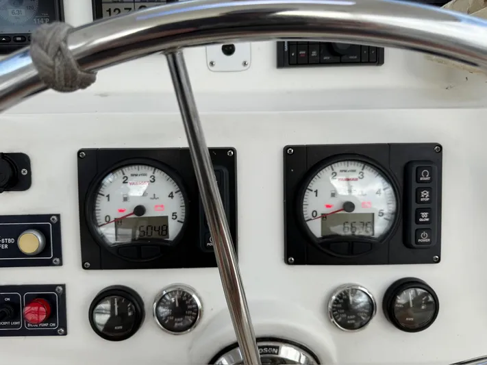  Yacht Photos Pics Control panel of a 2012 Leopard 39 Owner's Version yacht with gauges and switches.