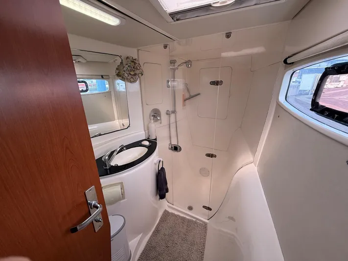  Yacht Photos Pics Bathroom interior of 2012 Leopard 39 Owner's Version yacht, featuring shower and sink.