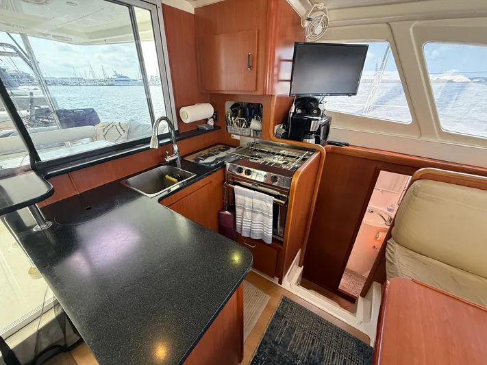  Yacht Photos Pics Interior of 2012 Leopard 39 Owner's Version yacht kitchen with modern amenities.