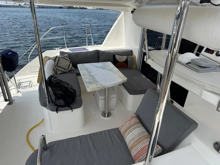  Yacht Photos Pics 2012 Leopard 39 Owner's Version yacht interior with cozy seating and nautical decor.
