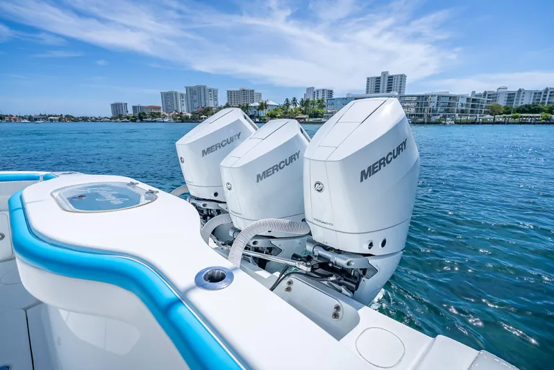  Yacht Photos Pics 2016 Yellowfin 39 Offshore boat with triple Mercury engines on blue water.