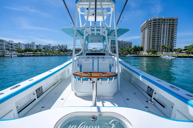  Yacht Photos Pics 2016 Yellowfin 39 Offshore boat on water, with modern design and cityscape background.