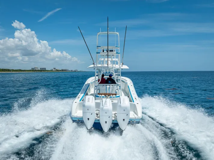  Yacht Photos Pics 2016 Yellowfin 39 Offshore boat cruising on open ocean under clear blue sky.