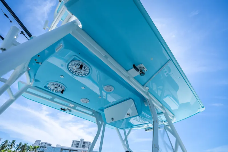  Yacht Photos Pics 2016 Yellowfin 39 Offshore boat canopy with speakers, under a clear blue sky.