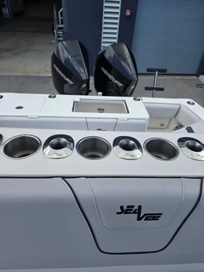Seavee Yacht Photos Pics 2022 SeaVee 290B boat with dual Mercury engines and multiple cup holders.