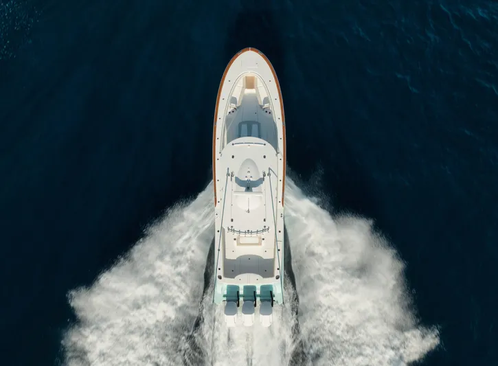  Yacht Photos Pics Aerial view of 2025 Mag Bay 43 CC boat cruising on open water.
