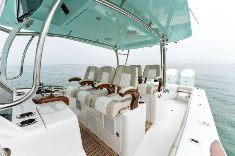  Yacht Photos Pics 2025 Mag Bay 43 CC boat interior with luxurious seating and helm station.