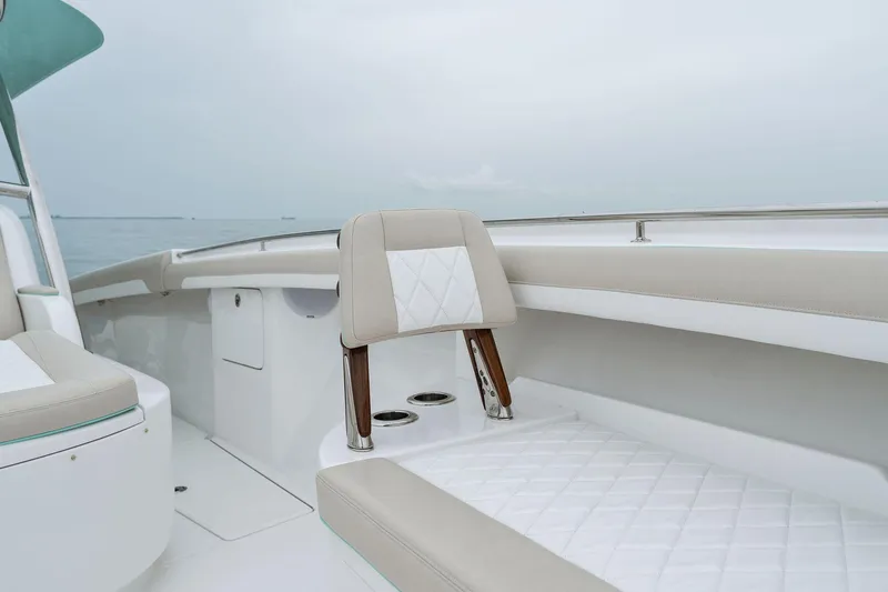 Yacht Photos Pics Interior seating of 2025 Mag Bay 43 CC boat with beige and white upholstery.