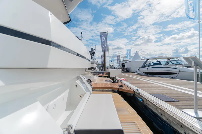Allouise Yacht Photos Pics 2022 Galeon 460 Fly yacht docked at marina under blue sky.