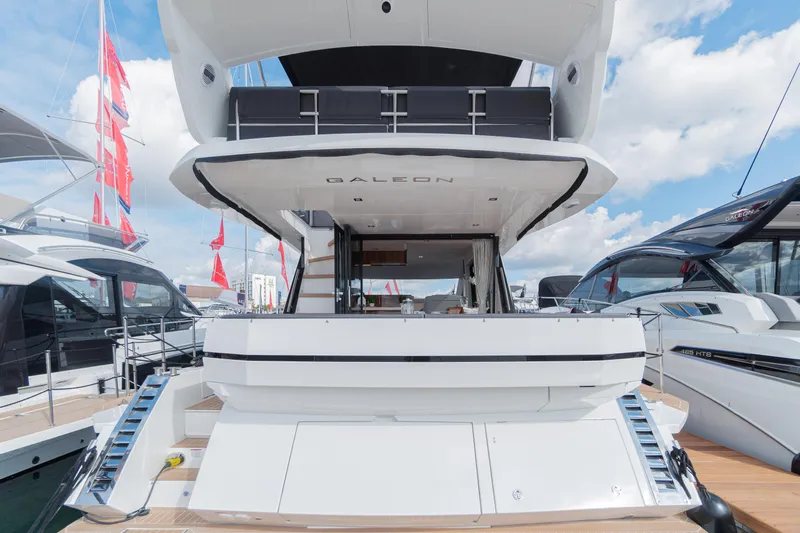 Allouise Yacht Photos Pics 2022 Galeon 460 Fly yacht, rear view, docked with open deck and modern design.