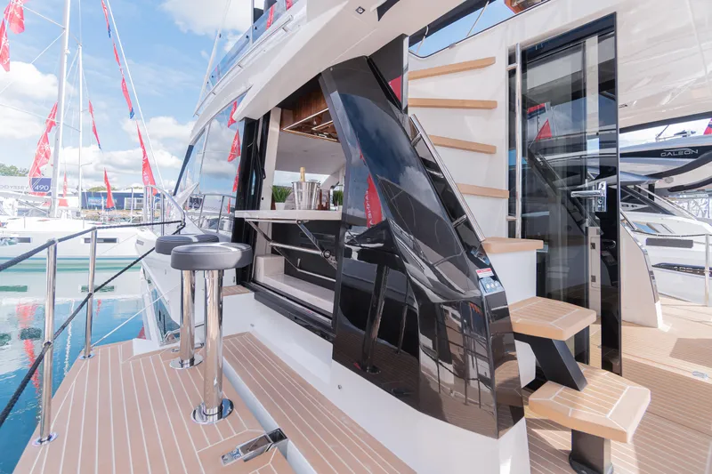 Allouise Yacht Photos Pics 2022 Galeon 460 Fly yacht with sleek design and modern outdoor seating area.