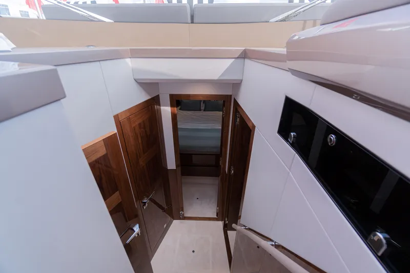 Allouise Yacht Photos Pics Interior view of 2022 Galeon 460 Fly yacht, featuring wooden doors and modern design.