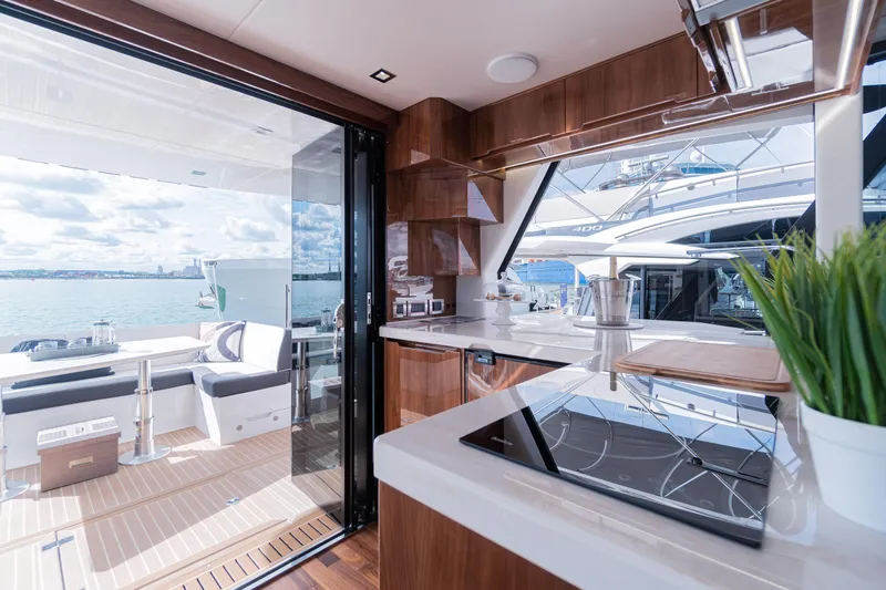 Allouise Yacht Photos Pics Luxurious interior of 2022 Galeon 460 Fly yacht with modern kitchen and sea view.