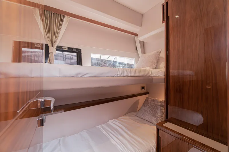 Allouise Yacht Photos Pics Interior of 2022 Galeon 460 Fly yacht with cozy bunk beds and elegant wood finish.