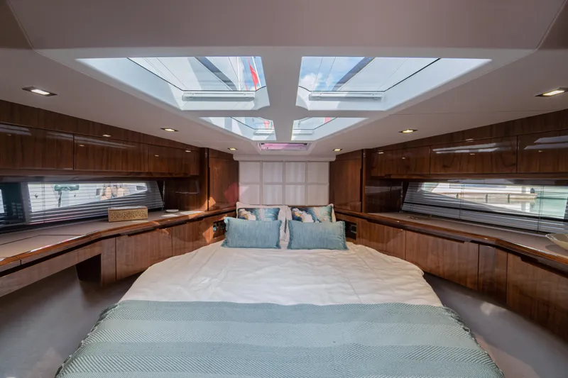 Allouise Yacht Photos Pics Luxurious bedroom interior of 2022 Galeon 460 Fly yacht with skylights and elegant wood finish.