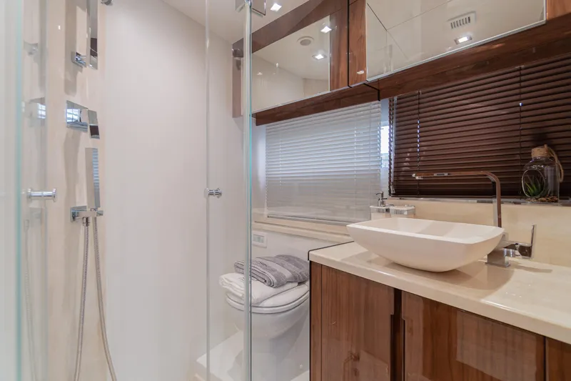 Allouise Yacht Photos Pics Luxurious bathroom in 2022 Galeon 460 Fly yacht with modern fixtures and elegant design.
