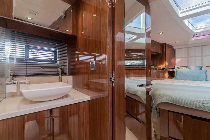 Allouise Yacht Photos Pics Luxurious interior of 2022 Galeon 460 Fly yacht with modern bathroom and cozy bedroom.
