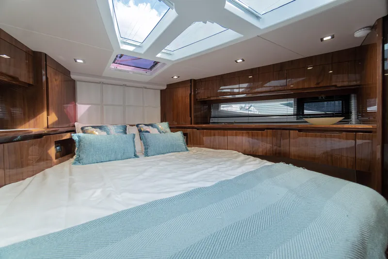 Allouise Yacht Photos Pics Luxurious cabin interior of 2022 Galeon 460 Fly yacht with skylights and elegant bedding.