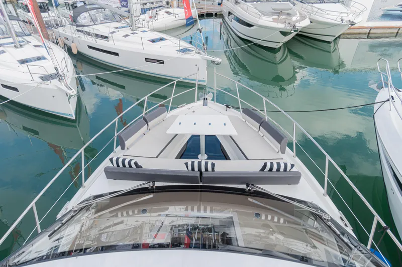 Allouise Yacht Photos Pics Galeon 460 Fly 2022 yacht docked among other boats in a marina.