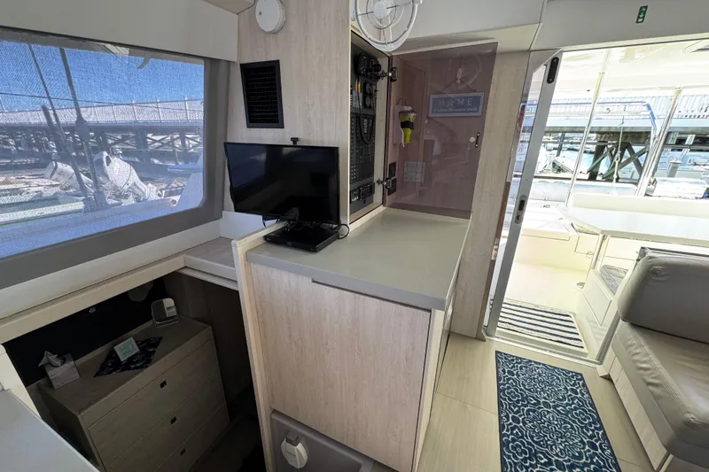 Daylight Yacht Photos Pics Interior of 2018 Leopard 40 catamaran with modern furnishings and marina view.