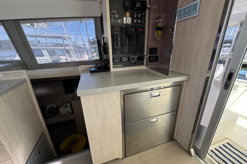 Daylight Yacht Photos Pics 2018 Leopard 40 yacht interior with control panel and stainless steel drawers.