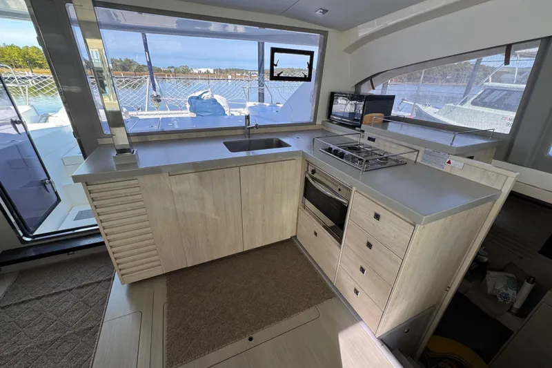 Daylight Yacht Photos Pics Modern kitchen interior on 2018 Leopard 40 catamaran with stove, oven, and sink.