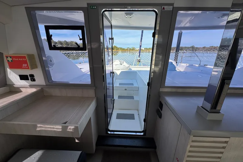 Daylight Yacht Photos Pics Interior view of 2018 Leopard 40 catamaran with outdoor deck access.