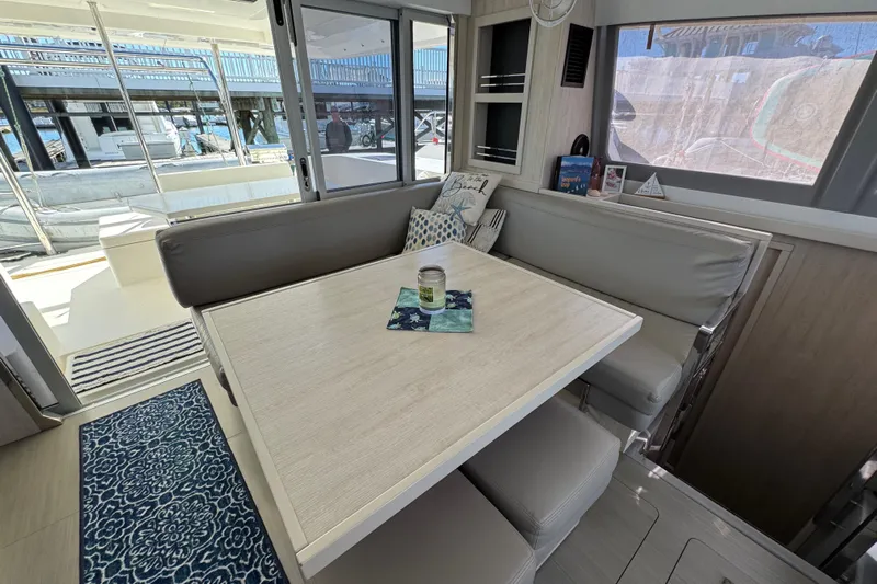 Daylight Yacht Photos Pics Interior of 2018 Leopard 40 catamaran with dining area and modern decor.