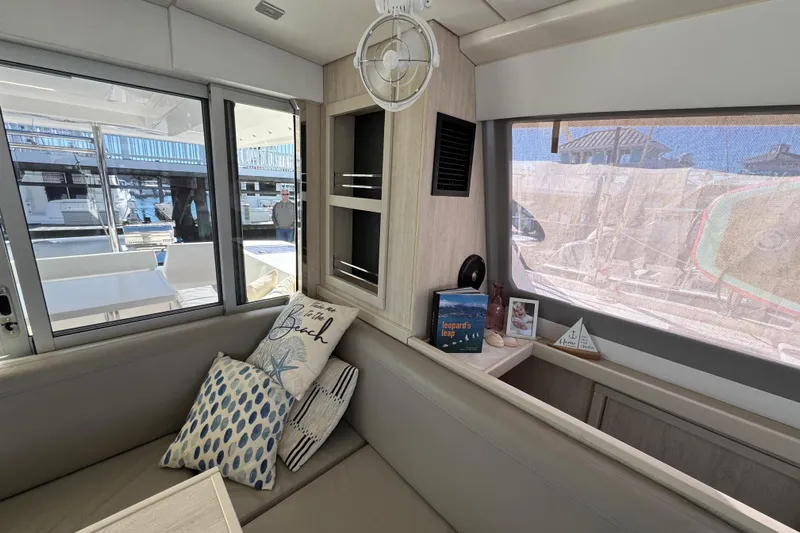 Daylight Yacht Photos Pics Interior of 2018 Leopard 40 catamaran with cozy seating and nautical decor.