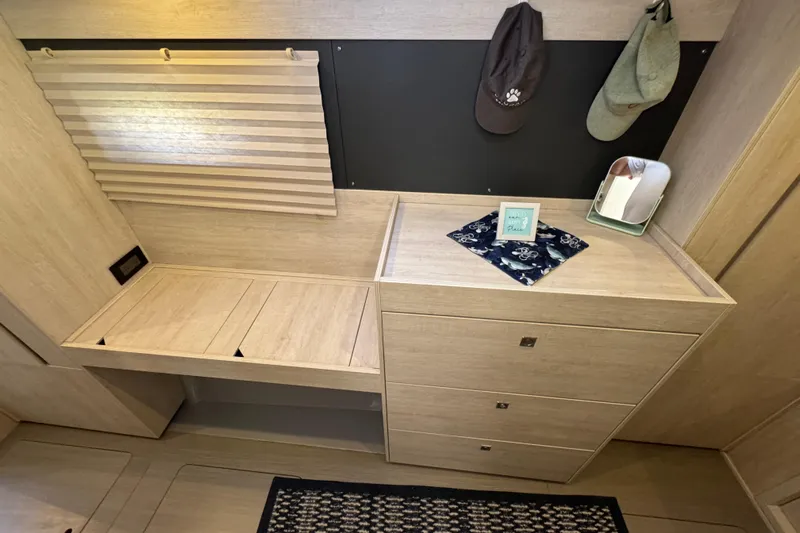Daylight Yacht Photos Pics Interior of 2018 Leopard 40 yacht with wooden cabinetry and decorative items.