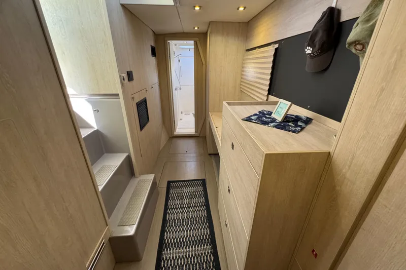 Daylight Yacht Photos Pics Modern interior of 2018 Leopard 40 yacht with wooden cabinetry and hallway view.
