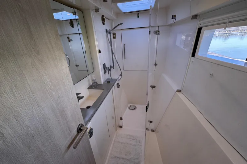 Daylight Yacht Photos Pics Bathroom interior of 2018 Leopard 40 yacht with shower and sink.