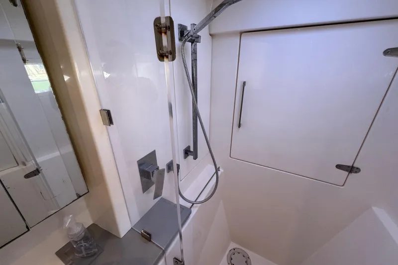 Daylight Yacht Photos Pics Modern shower area in 2018 Leopard 40 catamaran, featuring sleek fixtures and white interior.