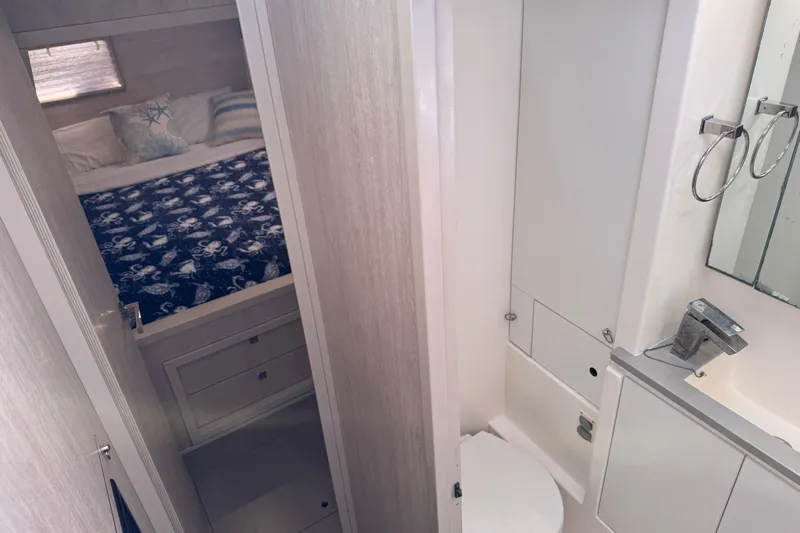 Daylight Yacht Photos Pics 2018 Leopard 40 yacht interior with bedroom and bathroom view.